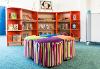 Kincaidston primary chill out area with bookcases and soft colourful stools