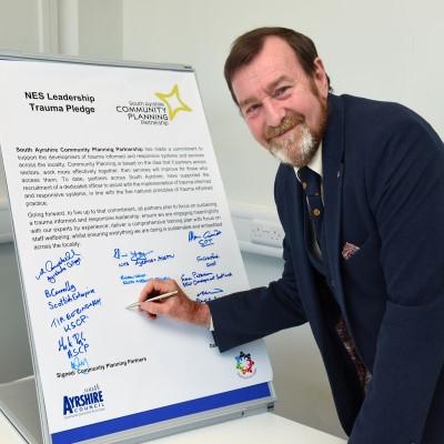 Cllr Henderson NES pledge signing 400 x 400